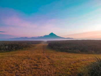 Scenic view of landscape against sky during sunset