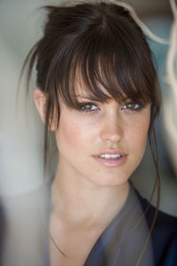 Close-up portrait of beautiful woman with bangs