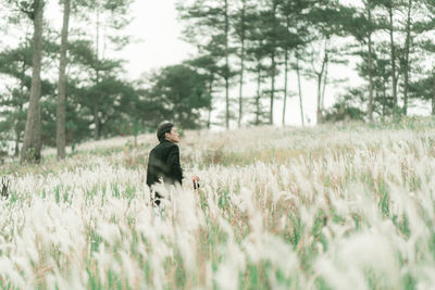 Young man standing on field