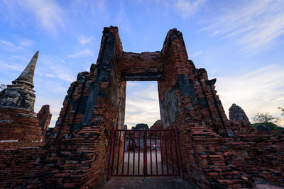 Low angle view of old ruin building against sky