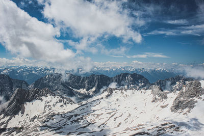 Scenic view of snowcapped mountains against sky