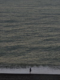 High angle view of woman standing on beach