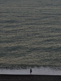 High angle view of woman standing on beach