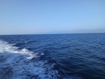 Scenic view of sea against clear blue sky