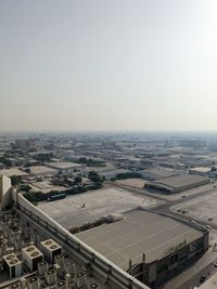 High angle view of buildings in city against clear sky