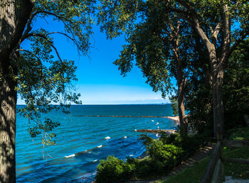 Scenic view of sea against blue sky