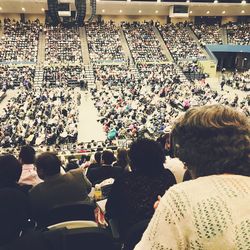 Rear view of people sitting in stadium