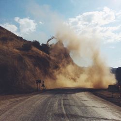 Road amidst landscape against sky