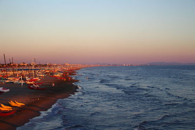 Scenic view of sea against clear sky during sunset