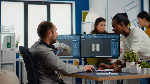 People working on table in office