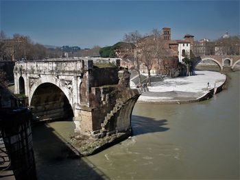 Bridge over river against clear sky