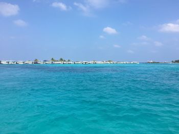 Scenic view of sea against blue sky