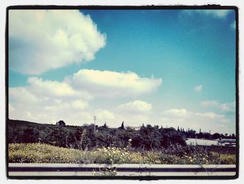 Scenic view of landscape against cloudy sky