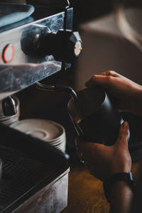 Cropped hand of person holding coffee