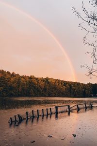 Scenic view of rainbow against sky during sunset