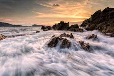 Scenic view of sea against sky during sunset