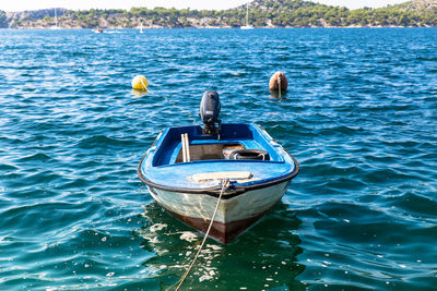 Rear view of man in boat on sea