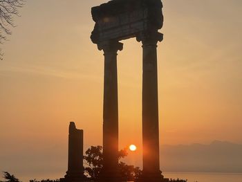 Silhouette of historical building during sunset