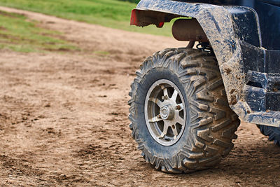 View of tire track on dirt road