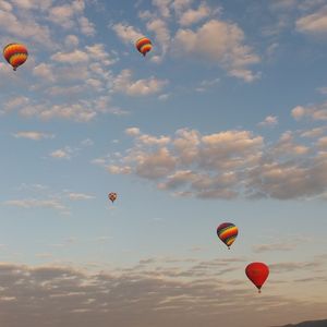 Low angle view of hot air balloons flying in sky