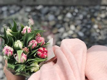 Close-up of hand holding bouquet