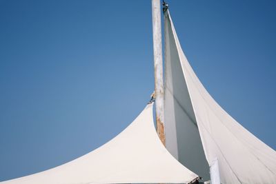 Low angle view of built structure against blue sky