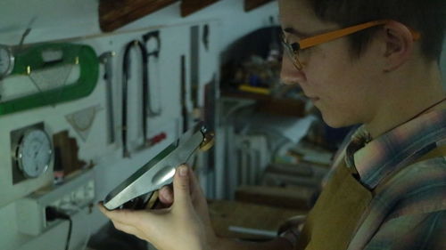 Side view of young woman using mobile phone