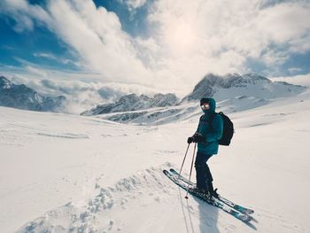 Man skiing on snowcapped mountain