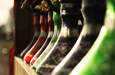 Close-up of multi colored bottles