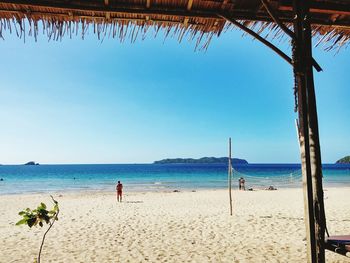 Scenic view of beach against blue sky