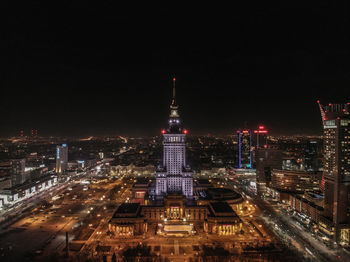 Illuminated buildings in city at night