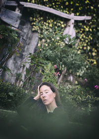 Woman in romantic pose between rustic houses, slovenia vii