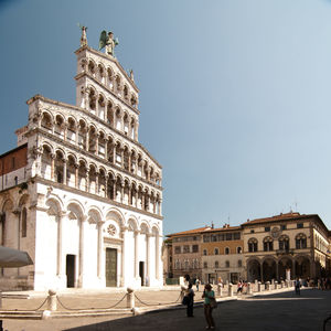 Statue in front of historical building