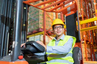 Portrait of smiling man working in office