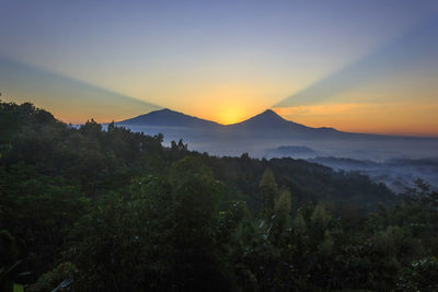 Scenic view of landscape against sky during sunset