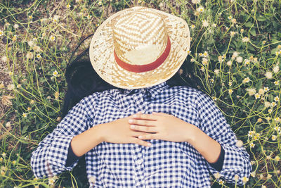 High angle view of woman wearing hat on field