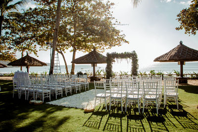 Chairs and tables against sky