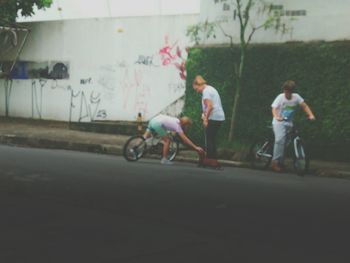 Man riding bicycle on road