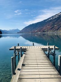 Pier over lake against sky