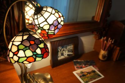 Close-up of illuminated lamp shade at home