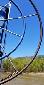 Close-up of metallic structure against clear blue sky