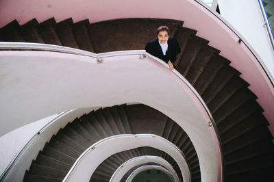 Low angle view of woman standing on steps