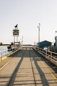 Street by road against clear sky