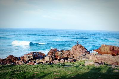 Scenic view of sea against cloudy sky