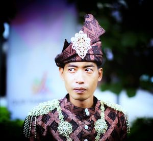 Close-up of man in traditional clothing looking away