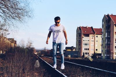 Full length of man standing against sky