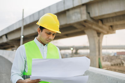 Young man working at construction site