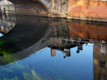 Reflection of buildings in puddle