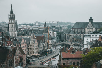 High angle view of city buildings against sky