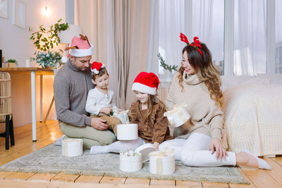 Merry christmas and new year's holiday, cheerful family with small children